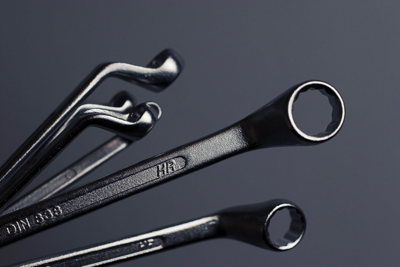 A black and whit image showing Mechanic Metal tools and Screw tools.