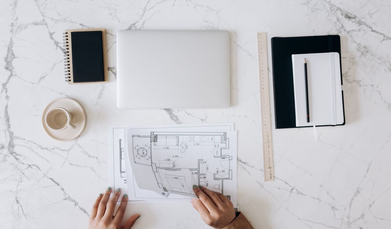 Image of architectural designs printed on a white desk