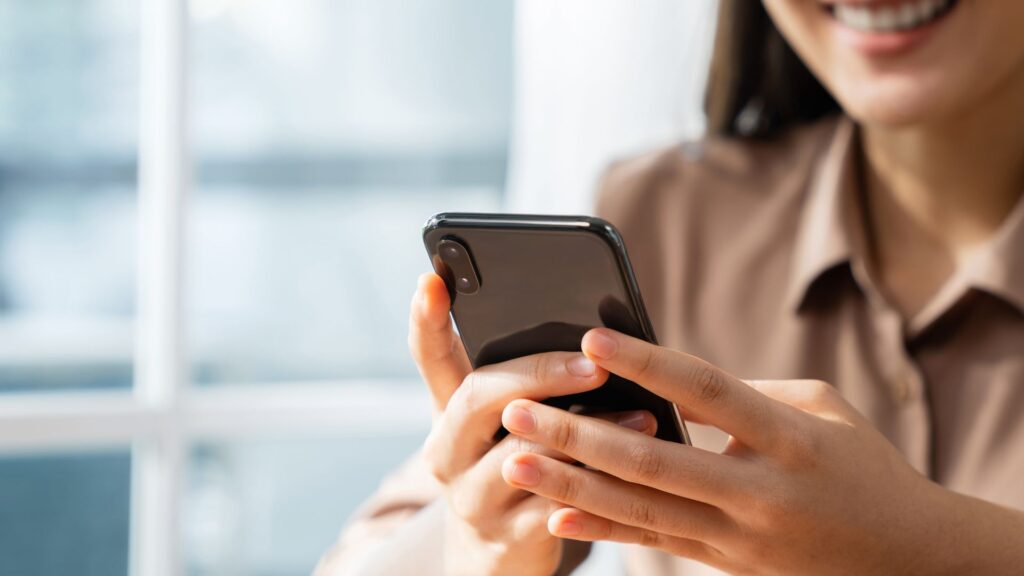 woman holding phone
